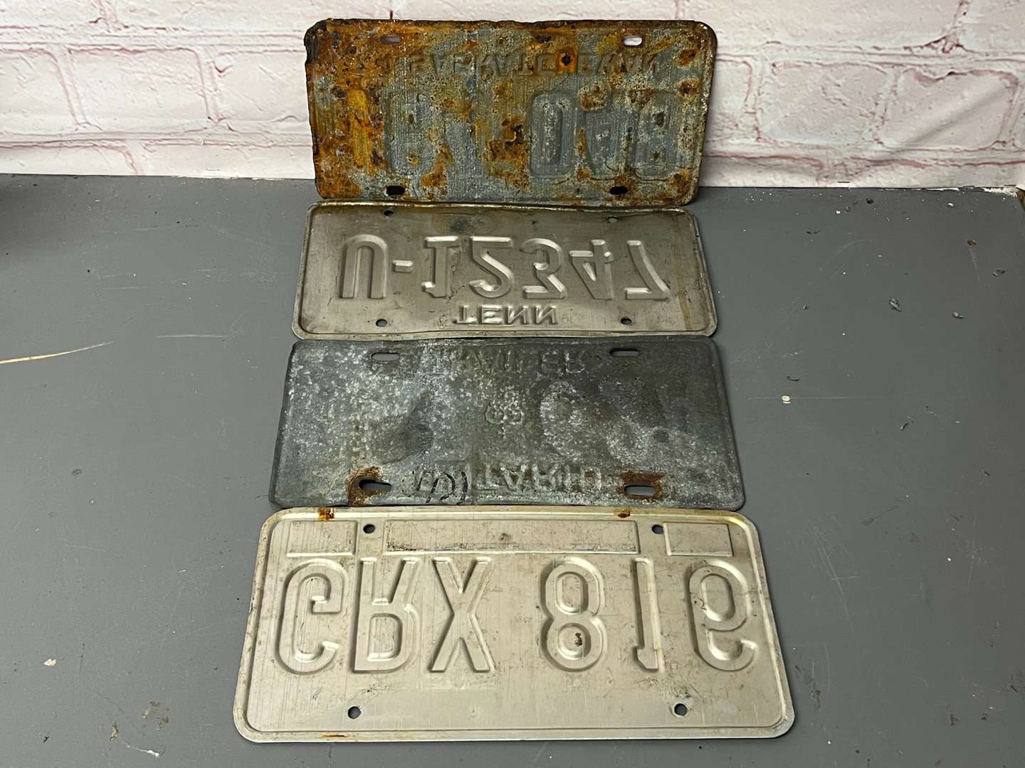 <p>Four American Number Plates&nbsp;</p>
