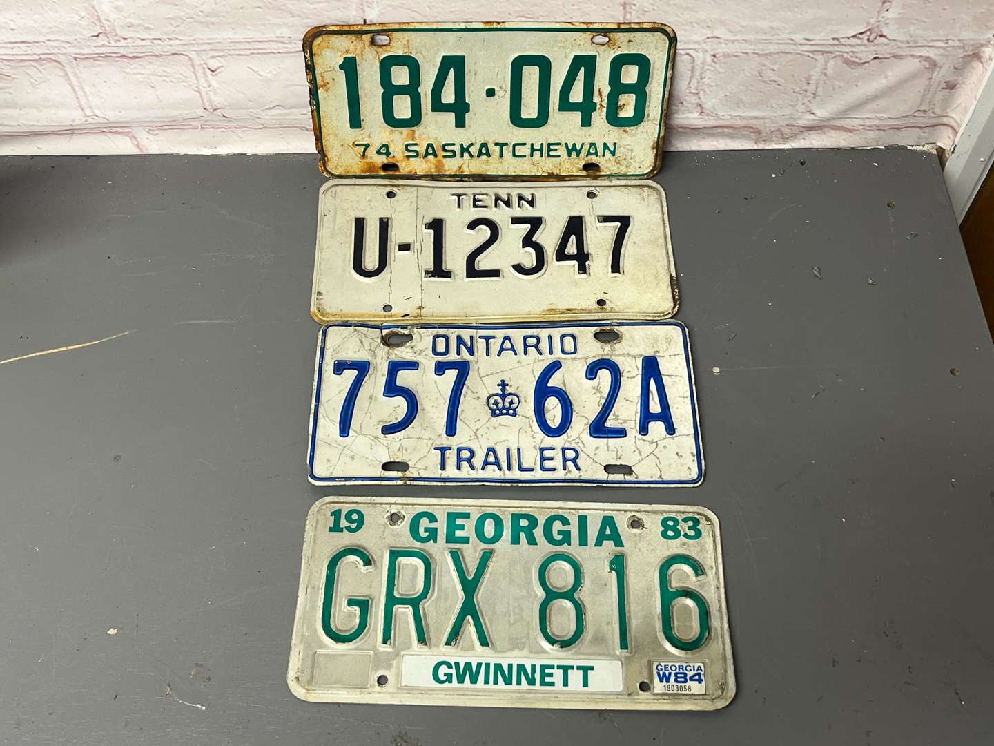 <p>Four American Number Plates&nbsp;</p>