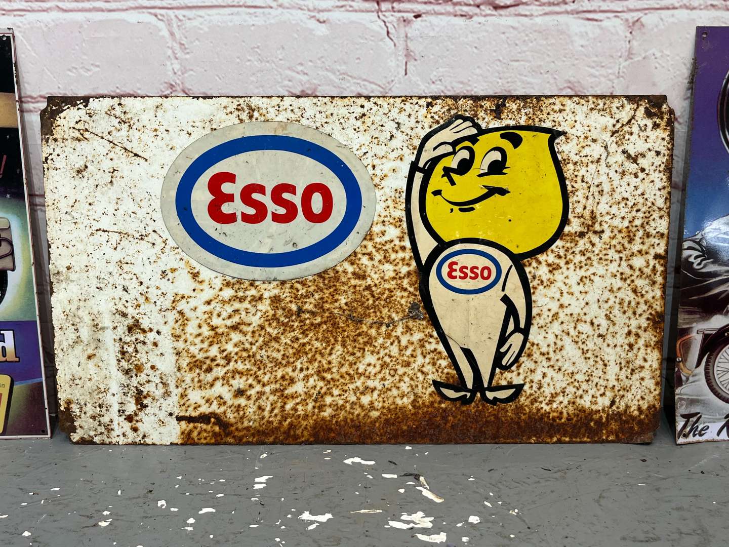 <p>Esso Mr Drip Metal Sign & AJS/Royal Enfield Tin Signs (3)&nbsp;</p>