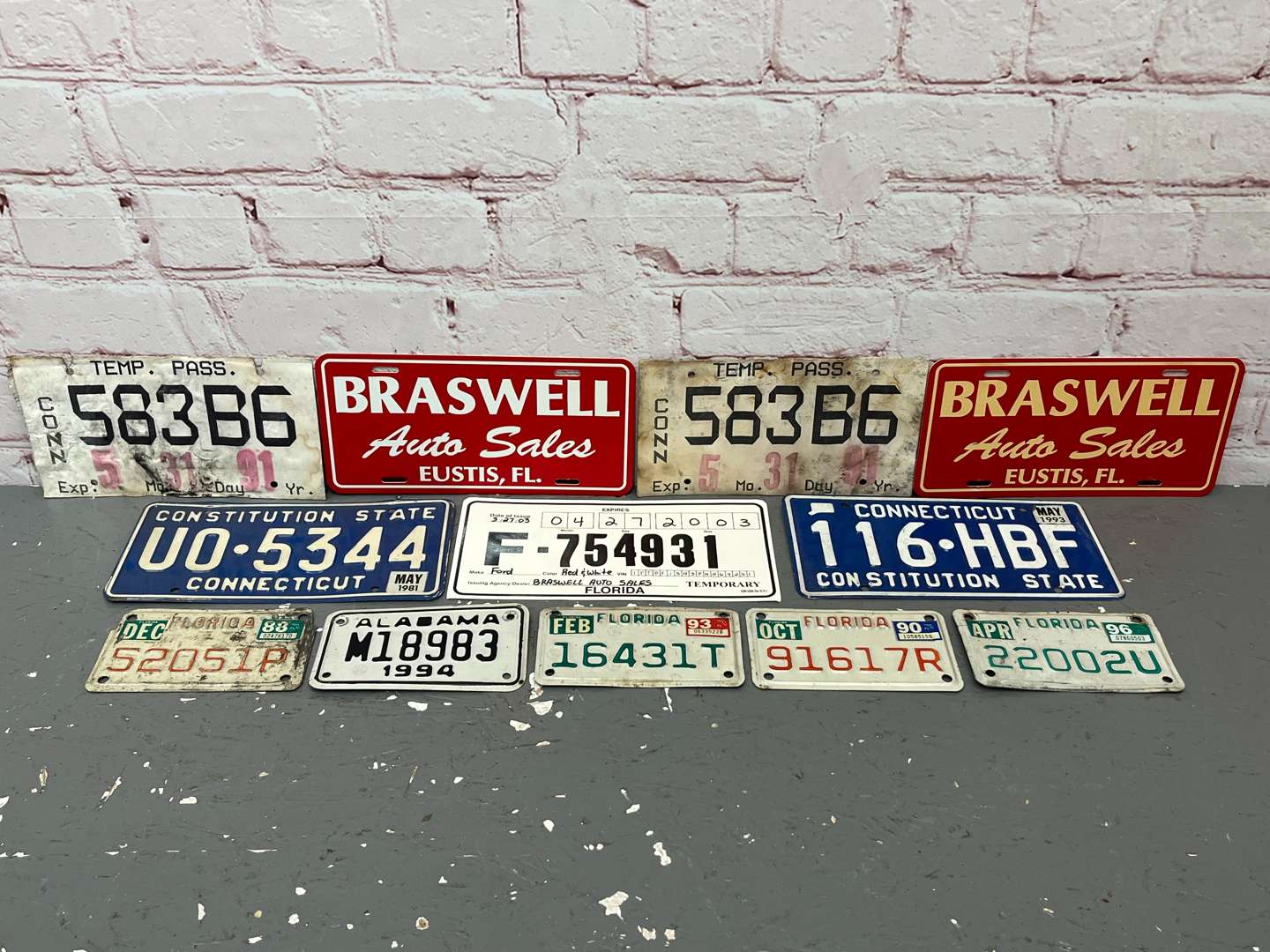 <p>Assorted American Number Plates & Dealer Signs</p>