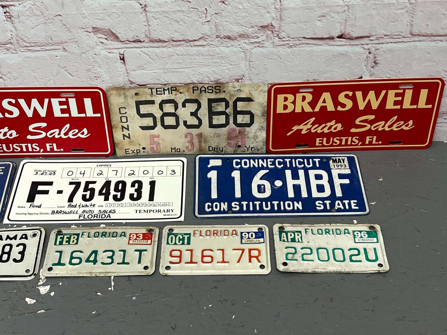 <p>Assorted American Number Plates & Dealer Signs</p>