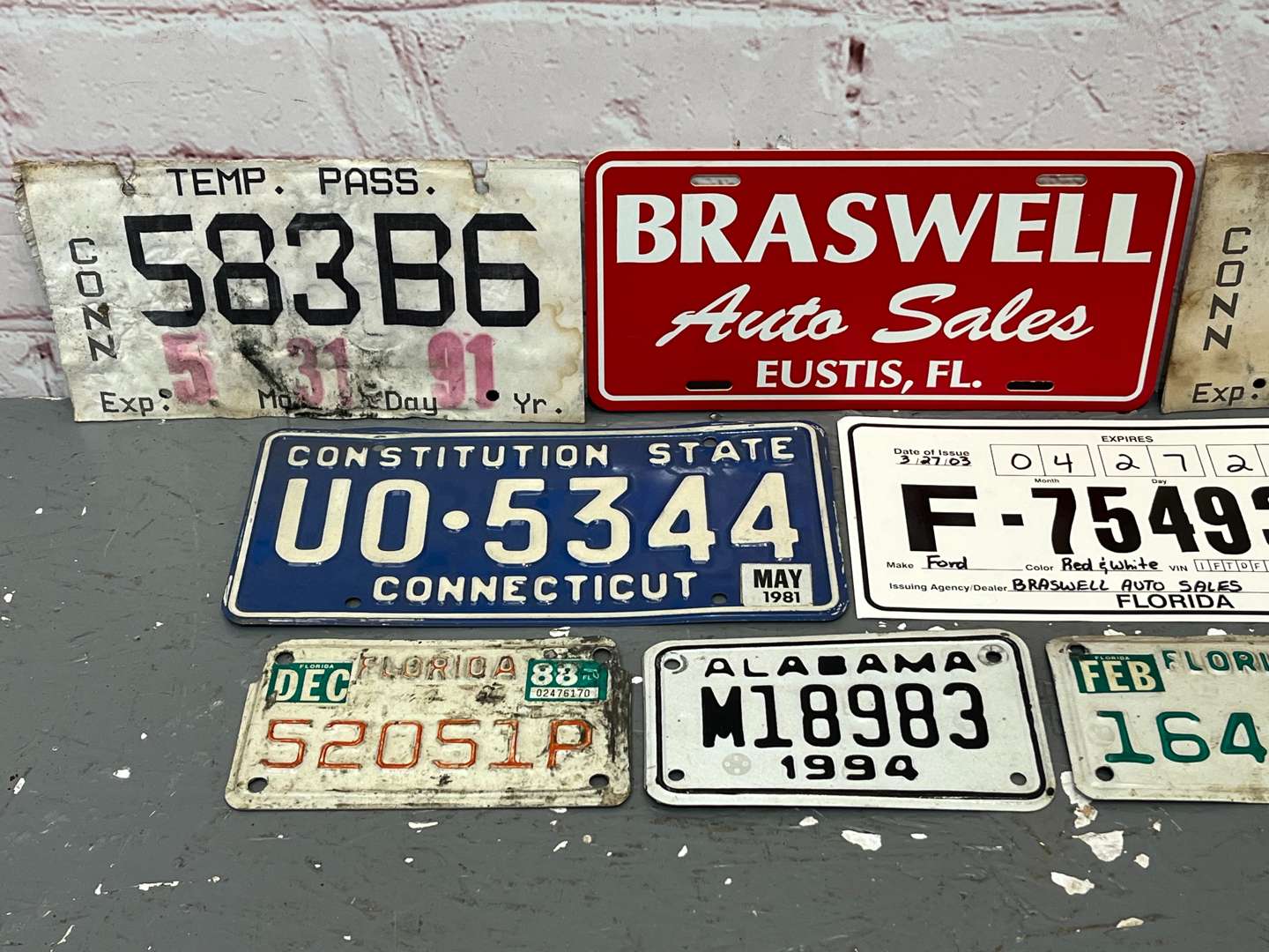 <p>Assorted American Number Plates & Dealer Signs</p>