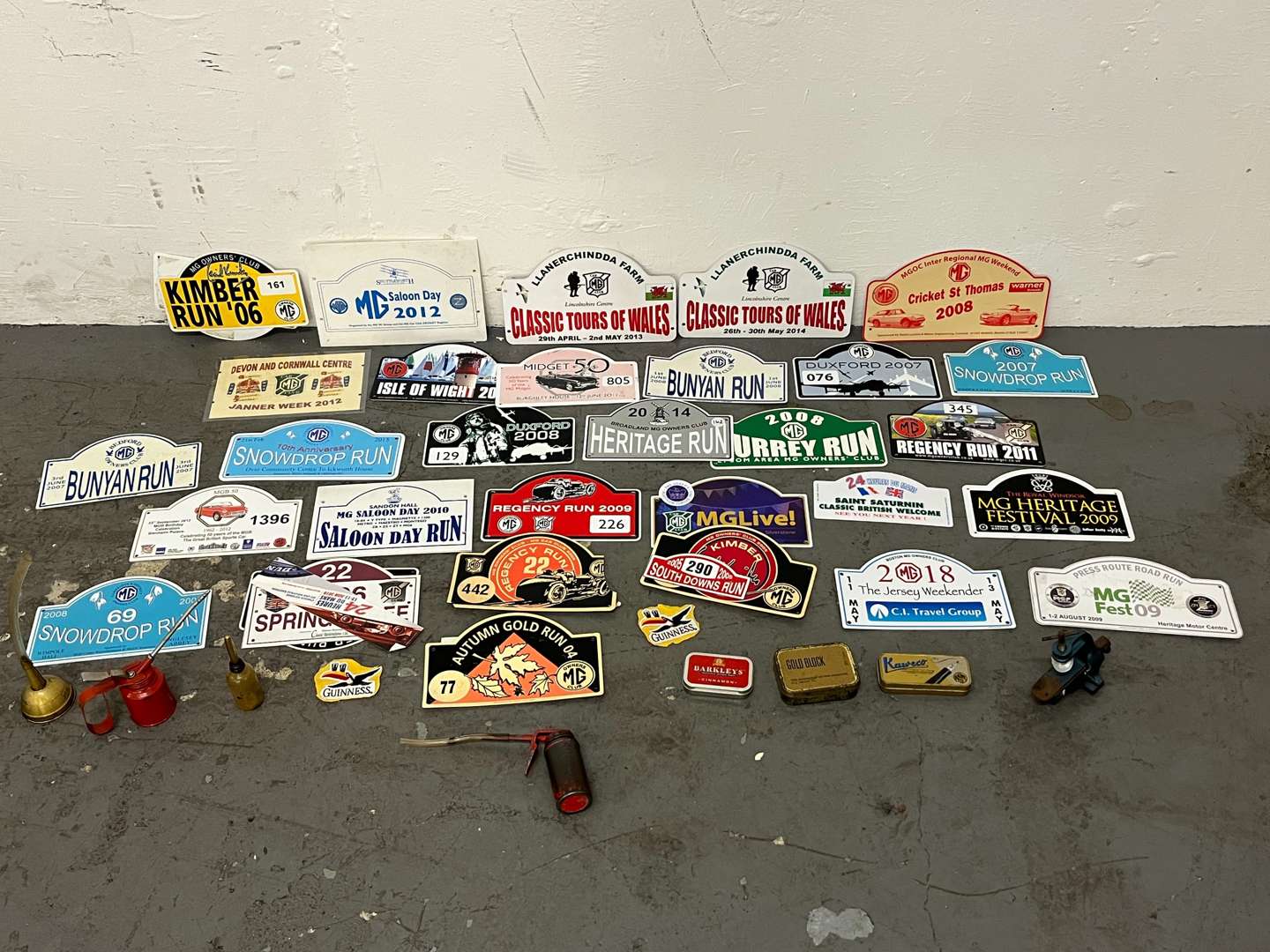 <p>Mixed Lot of Rally Plaques Oil Cans Etc</p>