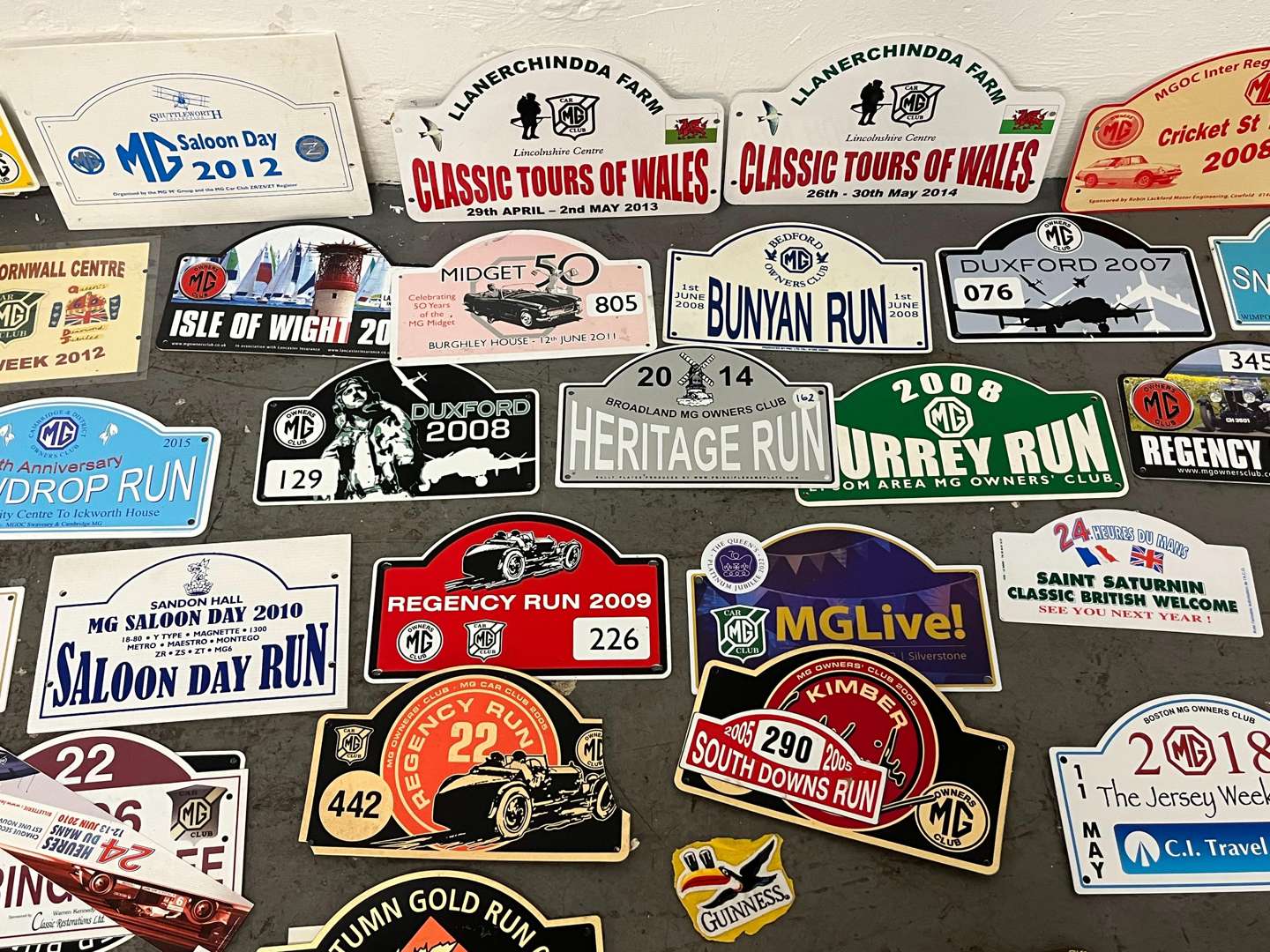 <p>Mixed Lot of Rally Plaques Oil Cans Etc</p>