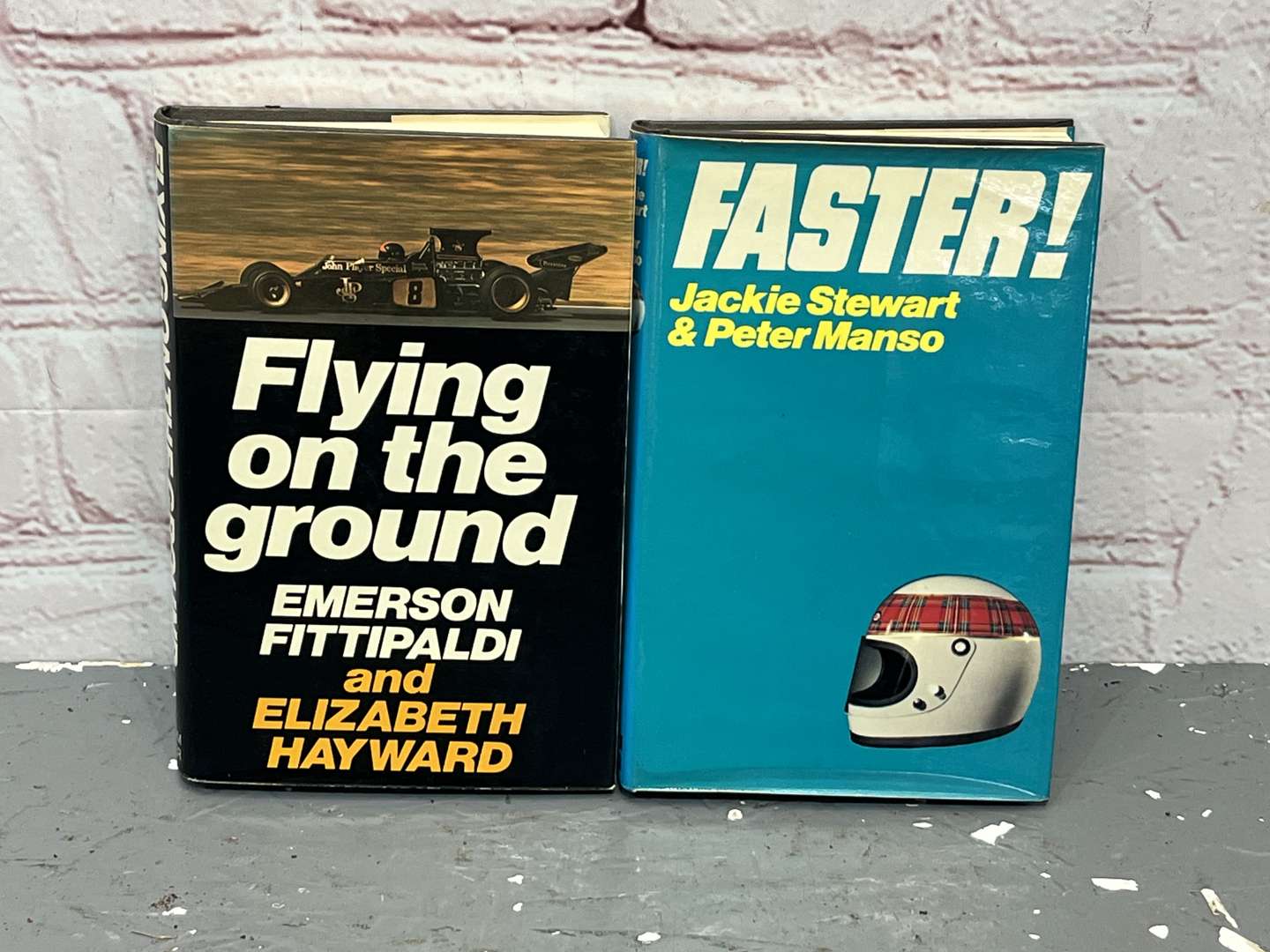 <p>Jackie Stewart Signed “Faster” & Emerson Fittipaldi Signed “ Flying on The Ground” Books</p>