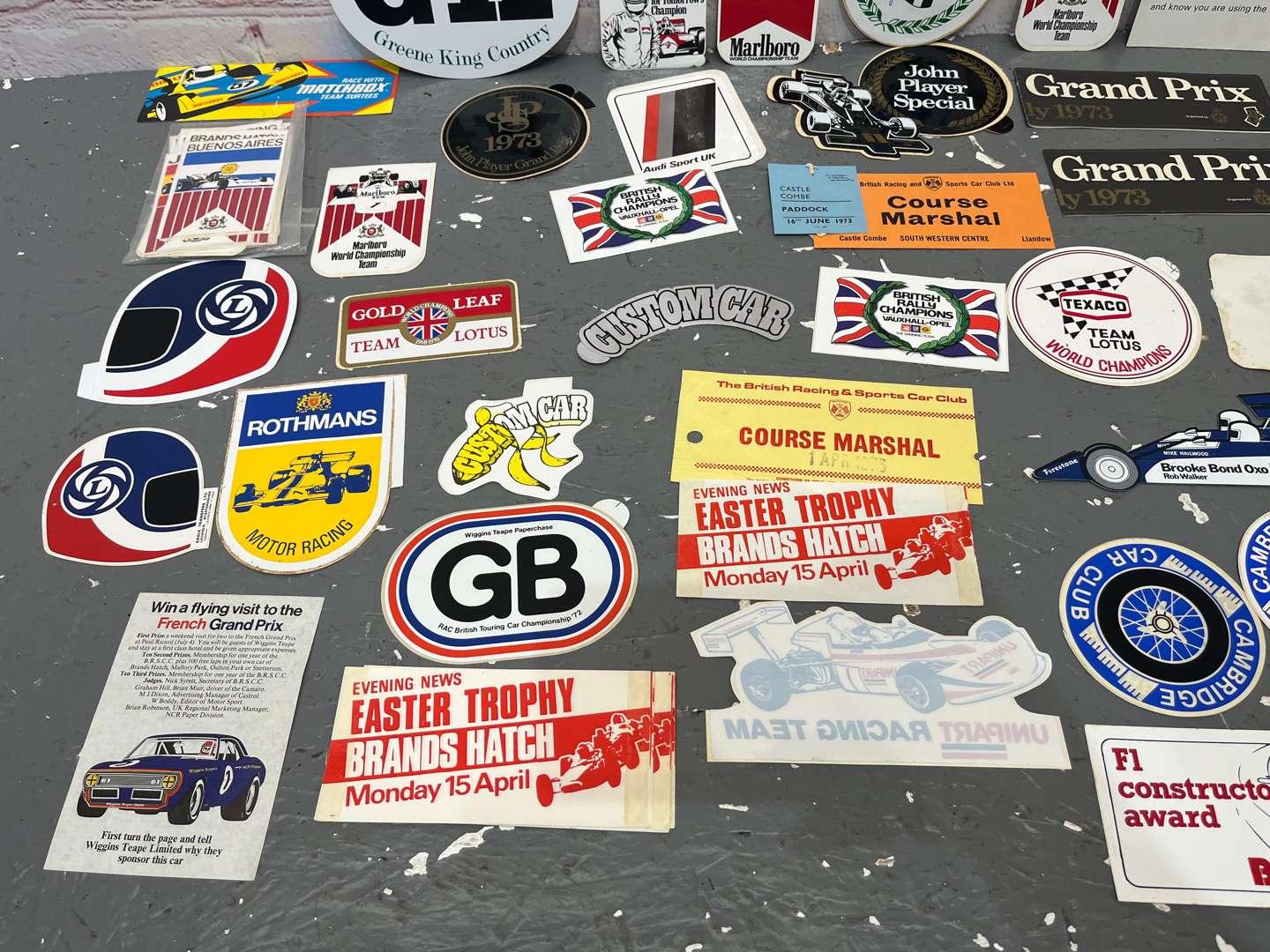 <p>Folder Containing a Quantity of 1970/80's Formula 1 Race Stickers</p>