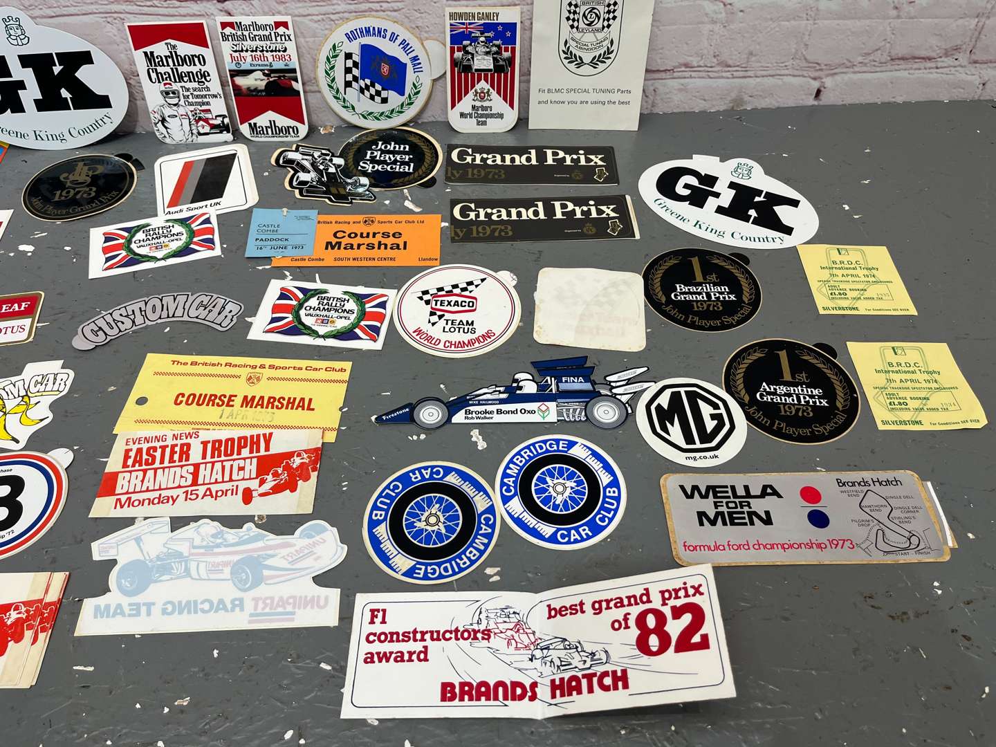 <p>Folder Containing a Quantity of 1970/80's Formula 1 Race Stickers</p>