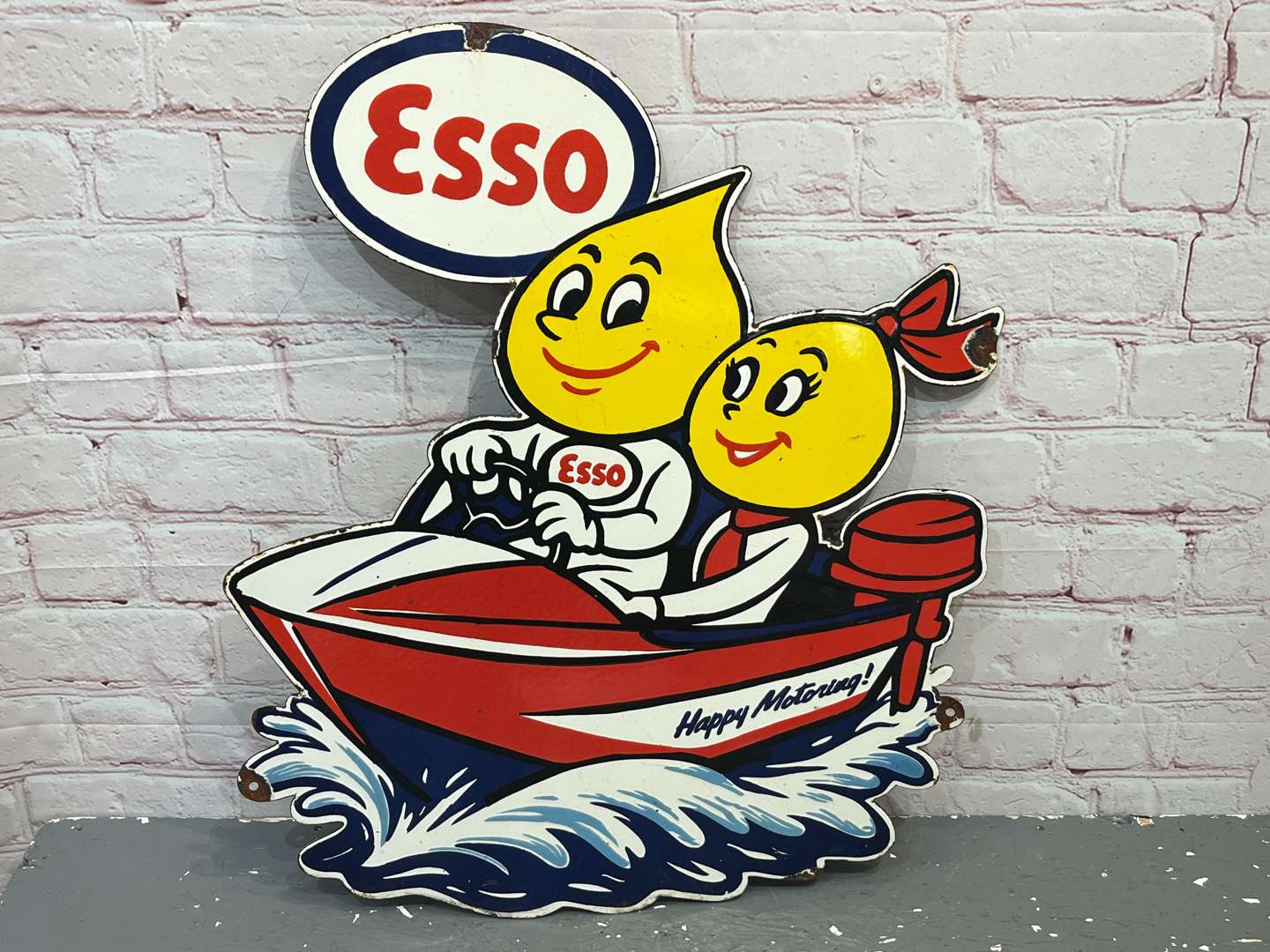<p>Esso Mr & Mrs Drip on a Speed Boat Enamel Sign</p>