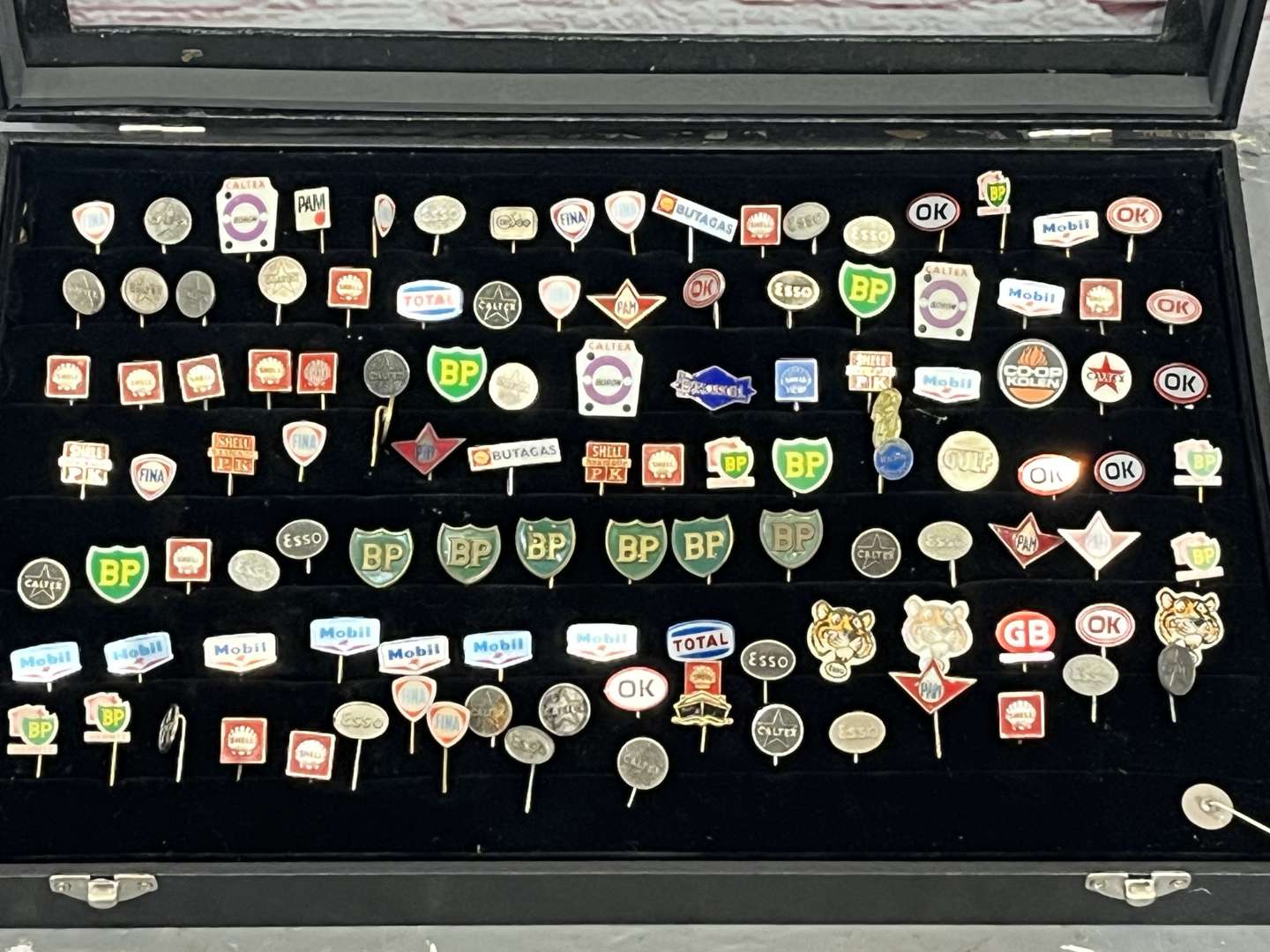 <p>Case Containing a Large Quantity Motoring Related Tie Pins&nbsp;</p>