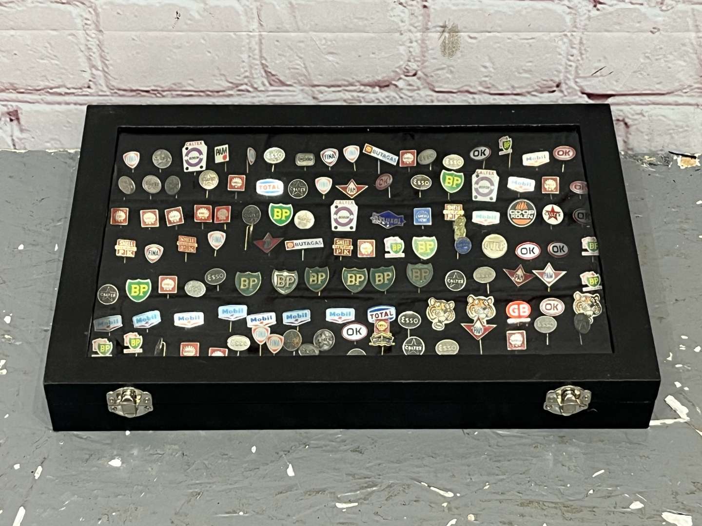 <p>Case Containing a Large Quantity Motoring Related Tie Pins&nbsp;</p>
