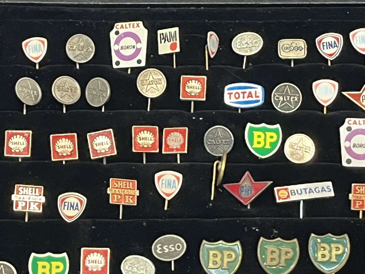 <p>Case Containing a Large Quantity Motoring Related Tie Pins&nbsp;</p>