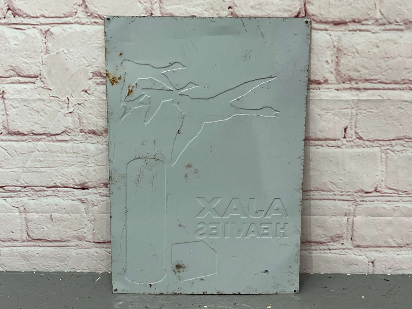 <p>Ajax Heavies Shotgun Shells Pressed Tin Sign</p>