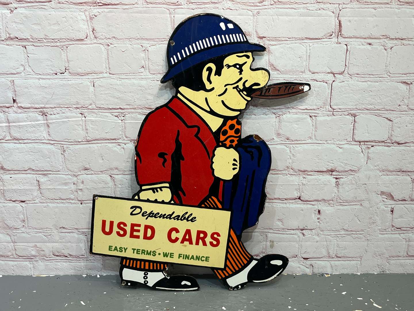 <p>Dependable Used Car Salesman Enamel Sign&nbsp;</p>