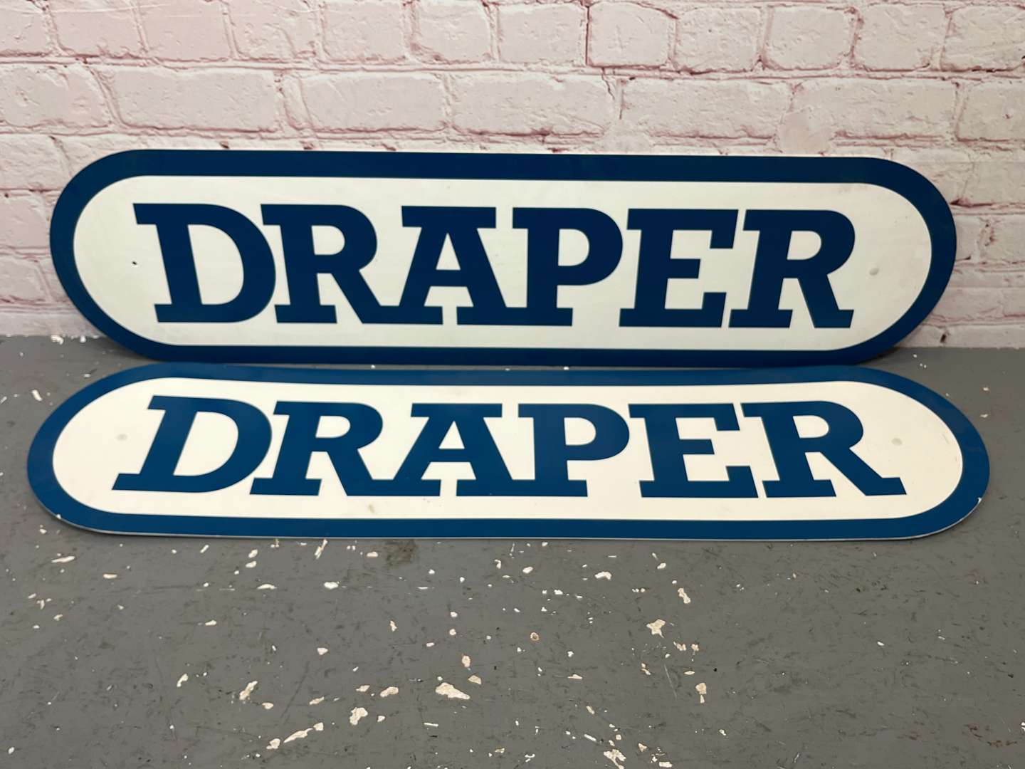 <p>Two Draper Tools Plastic Signs</p>