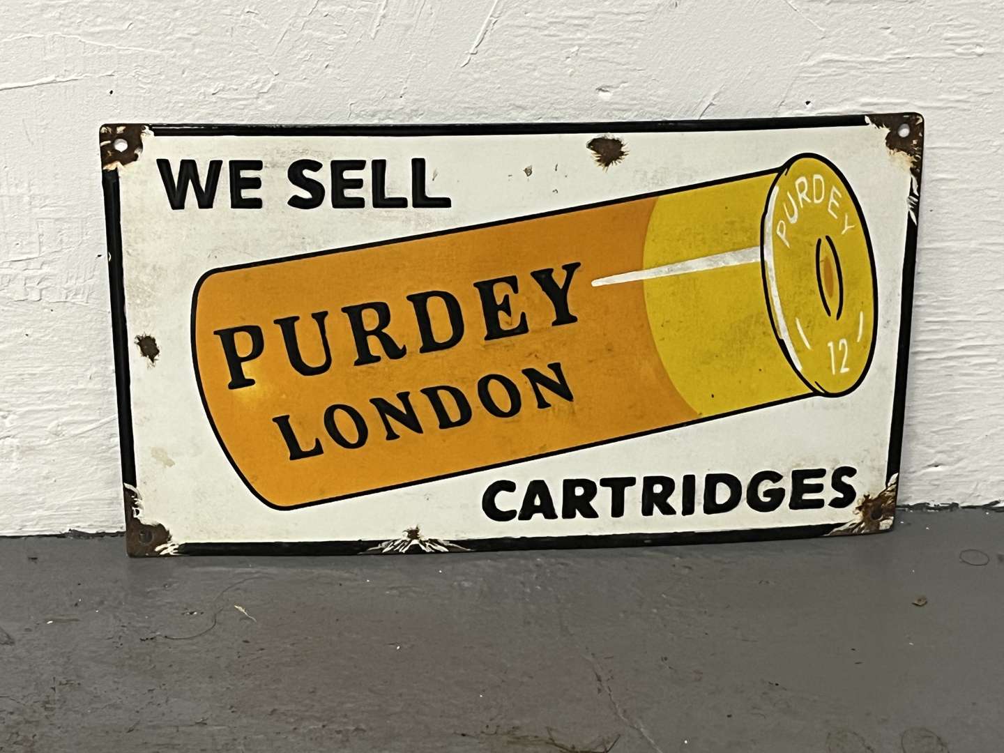 <p>We Sell Purdey London Cartridges Enamel Sign</p>
