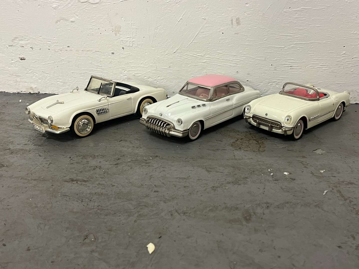 <p>Three Tin Plate Toy Cars</p>