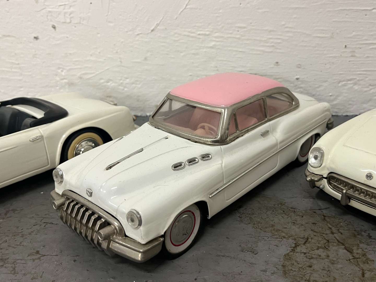 <p>Three Tin Plate Toy Cars</p>