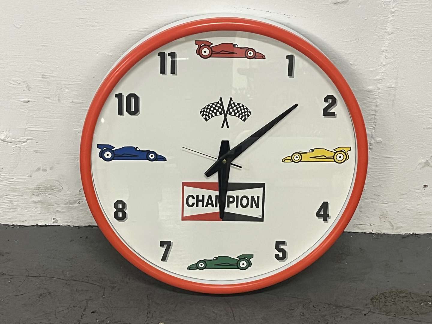 <p>Champion Spark Plug Wall Clock&nbsp;</p>