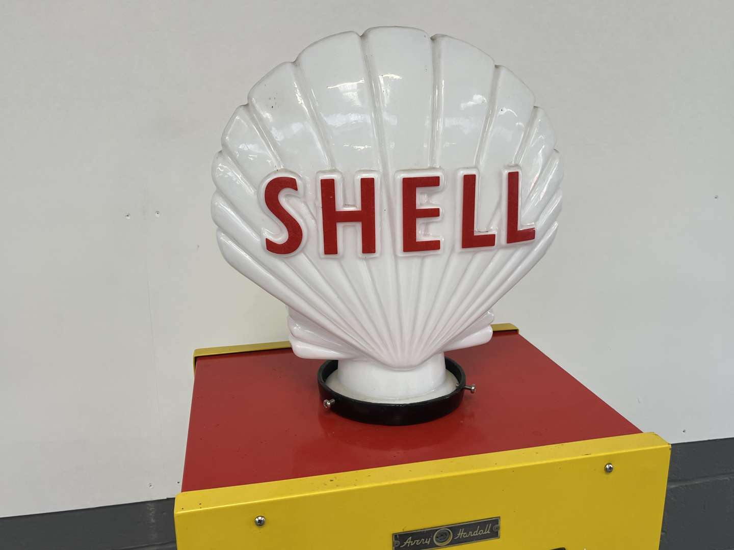 <p>Avery Hardoll Petrol Pump In Shell Livery With a Reproduction Glass Globe</p>