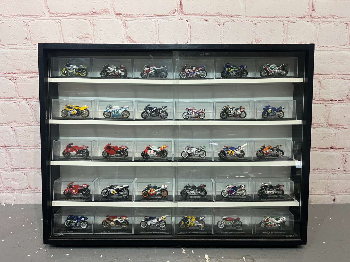 <p>Wall Mounted Display Case of 30 Motorbikes&nbsp;</p>